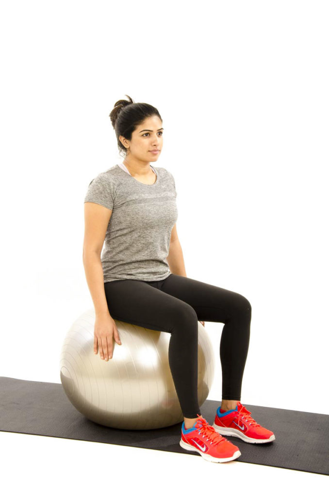 Leg Lift on gym ball with Trunk Rotation