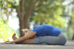 spinal stretch in flexion along with hamstrings stretch