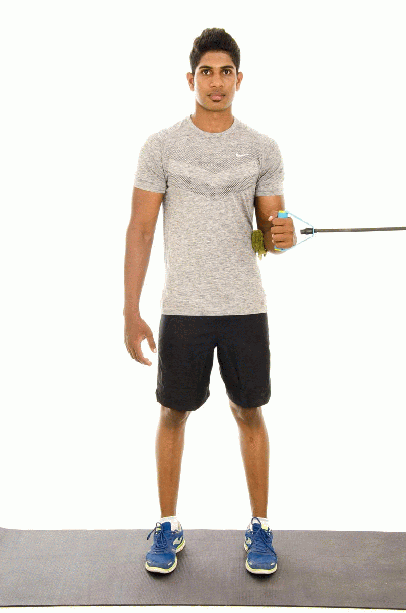 A man doing internal rotation with resistance band